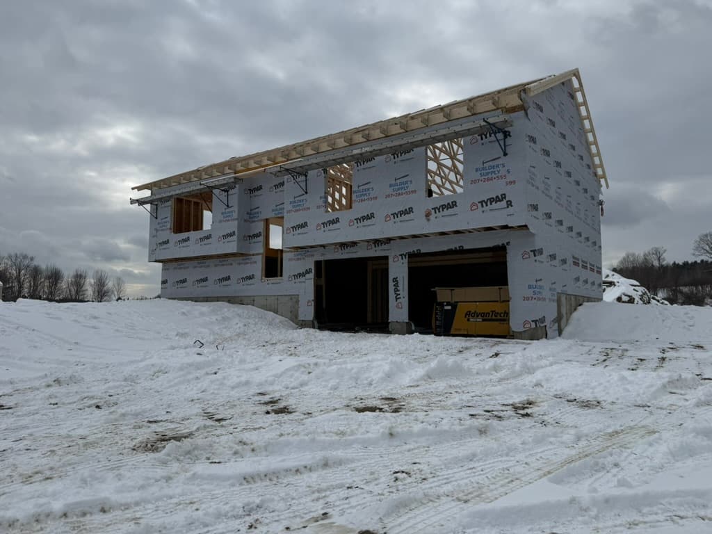 Apex Exteriors crew working on a New Hampshire roofing project